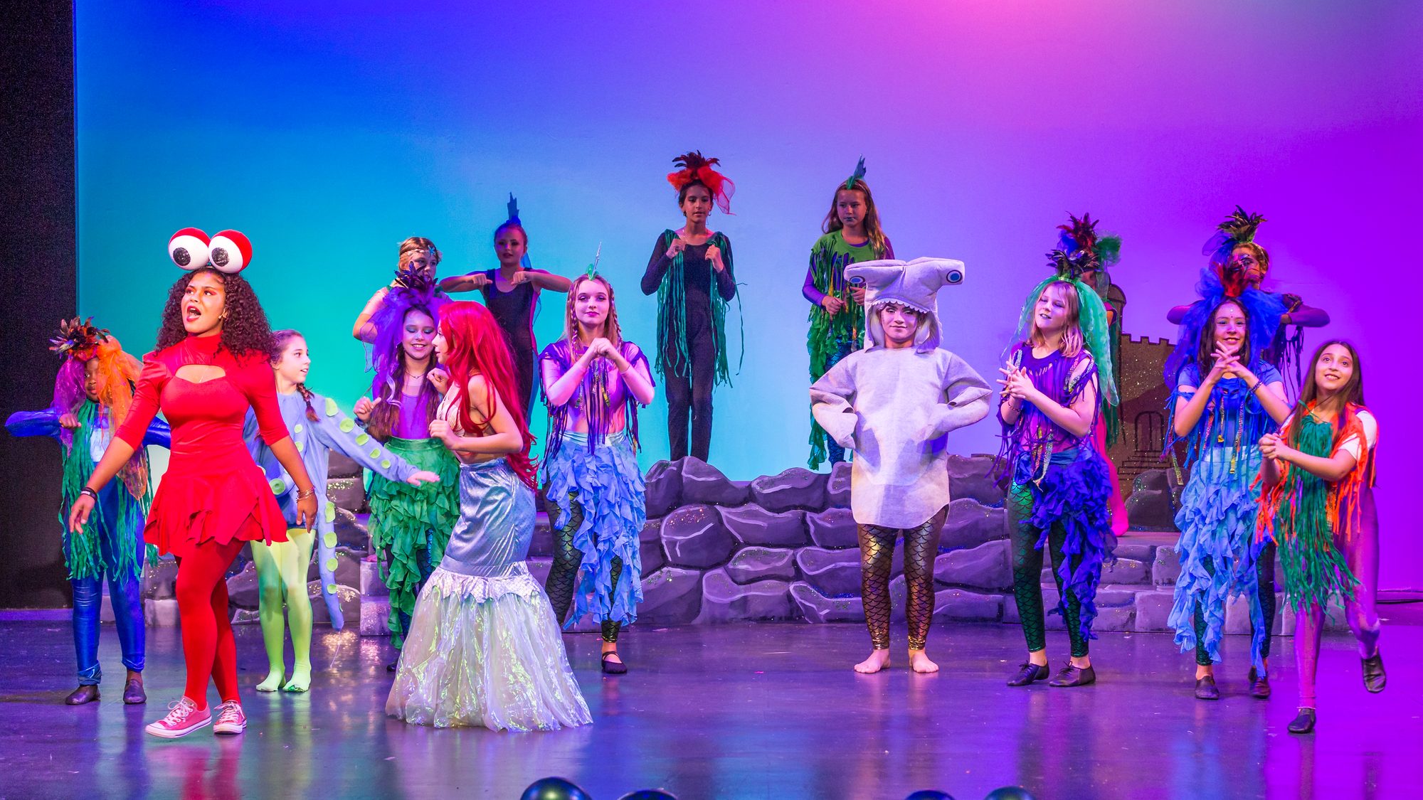 The cast of The Little Mermaid Jr. on stage, Camp Bravo 2019