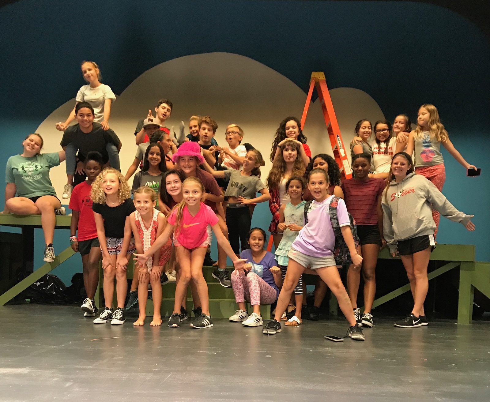 Campers gathered on the stage at rehearsal