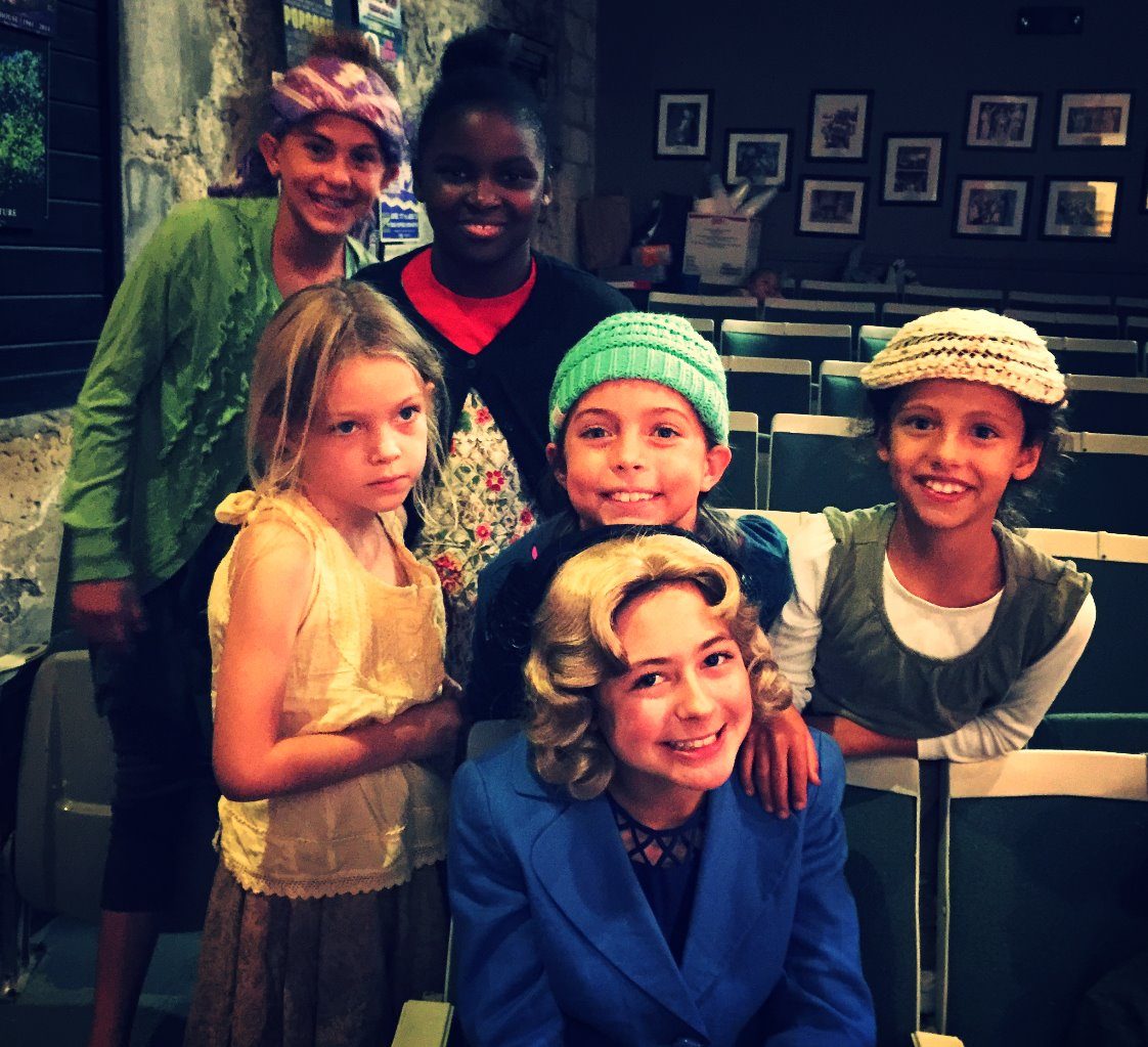 Campers in costume backstage