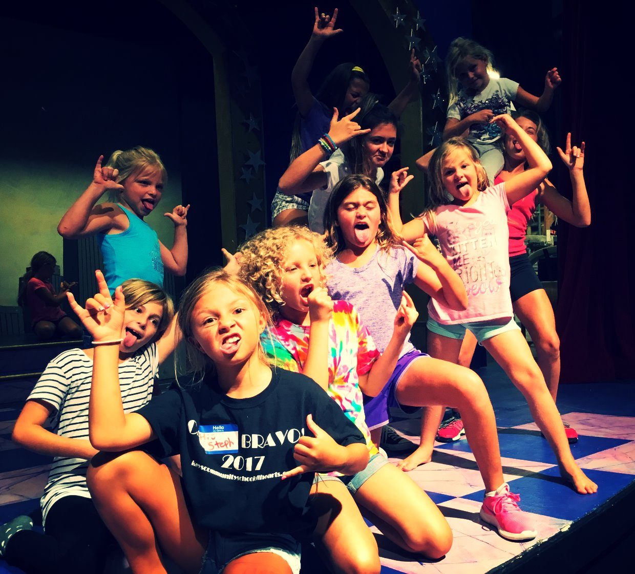 Campers clowning for the camera at rehearsal