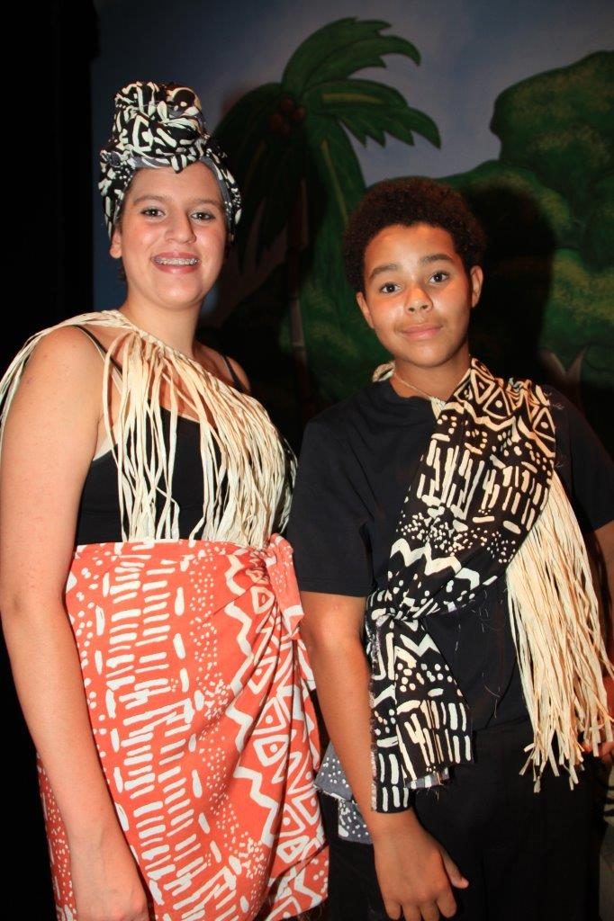 Two actors in island costumes