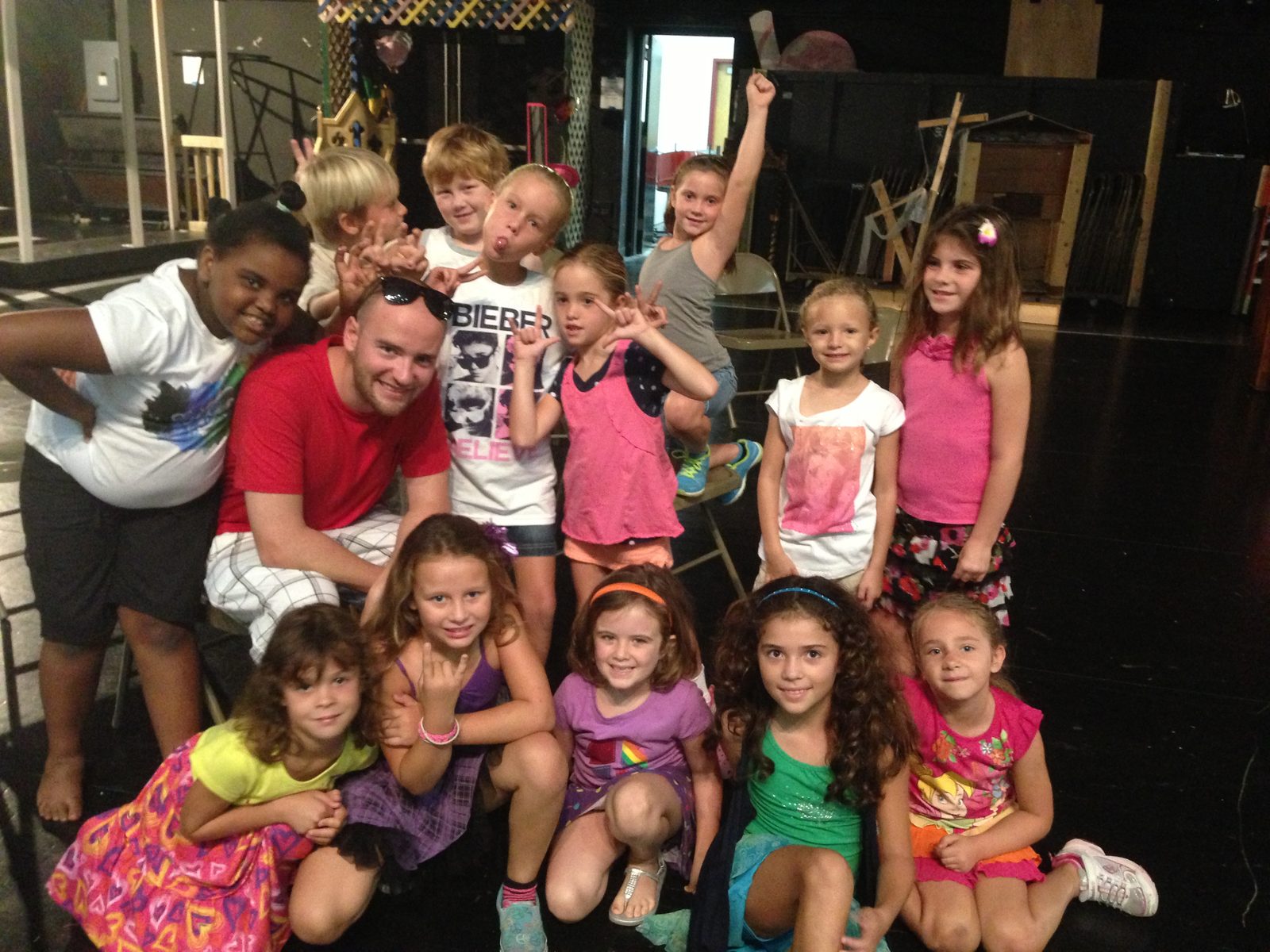 Campers and a counselor backstage