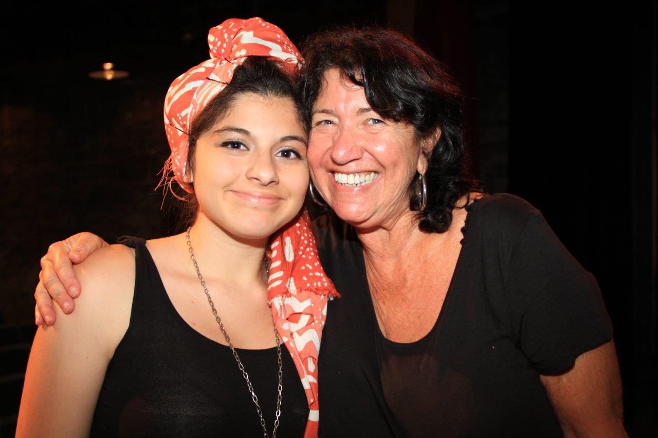 A camper and a director smiling together