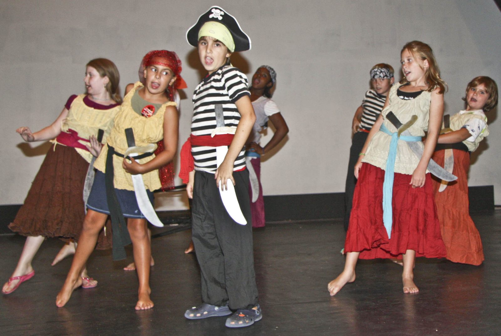 A pirate cast on stage