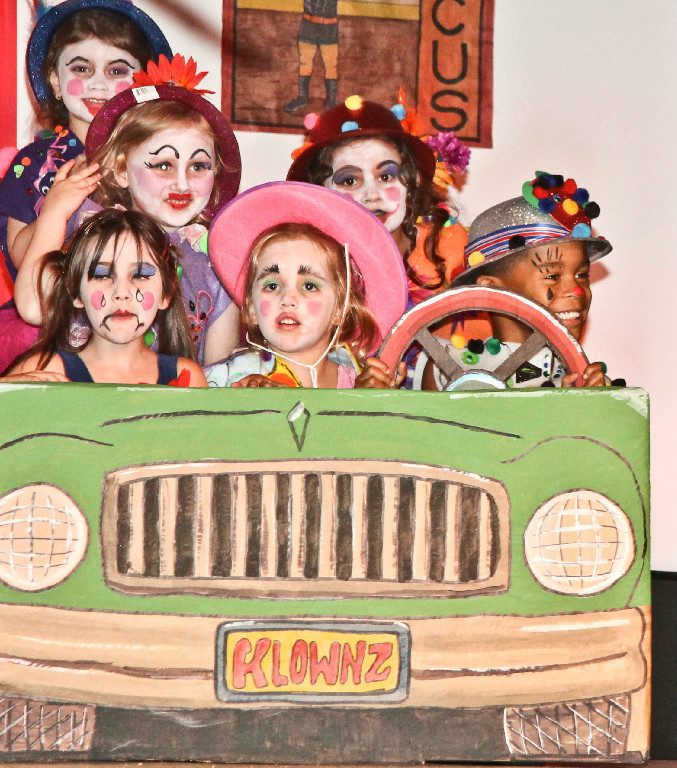 Clowns riding in a painted car