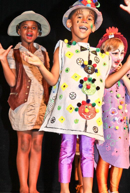 Performers in costume on stage